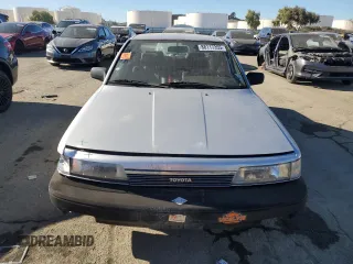 1988 Toyota Camry z VIN JT2SV24E5J3276324, wystawiony jako Copart lot #88117355 z przebiegiem 89 928 mil mil oraz Szkoda całkowita • Salvage title. Historia ofert i sprzedaży dostępna na DreamBid. Obrazek 5.