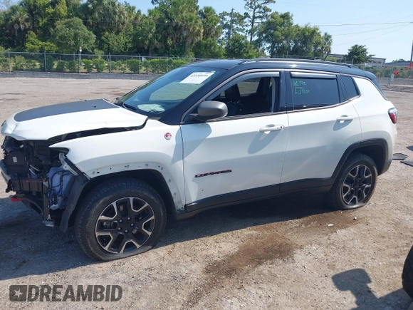 2021 Jeep Compass Trailhawk with VIN 3C4NJDDB7MT564467, listed as a IAAI auction lot 42330939 with 76,963 mi miles and . Bid and sale history available at DreamBid. Image 14.
