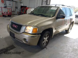 2004 GMC Envoy SLE with VIN 1GKDT13S442136464, listed as a IAAI auction lot 41874304 with 250,330 mi miles. Bid and sale history available at carsss.com. Image 2.