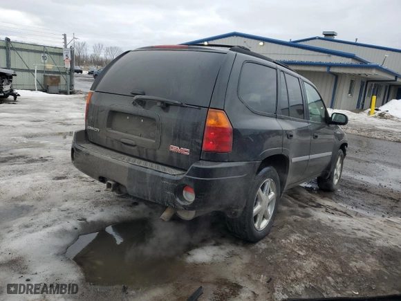 2007 GMC Envoy SLT with VIN 1GKDT13S972141714, listed as a Copart auction lot 46589735 with 82,556 mi miles and Salvage Title. Bid and sale history available at carsss.com. Image 3.