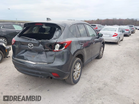 2015 Mazda CX-5 Touring with VIN JM3KE4CY1F0439016, listed as a IAAI auction lot 42039259 with 201,325 mi miles and . Bid and sale history available at carsss.com. Image 4.