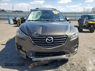 2016 Mazda CX-5 Grand Touring with VIN JM3KE4DY1G0806674, listed as a Copart auction lot 50549465 with 139,753 mi miles and Salvage Title. Bid and sale history available at carsss.com. Image 5.
