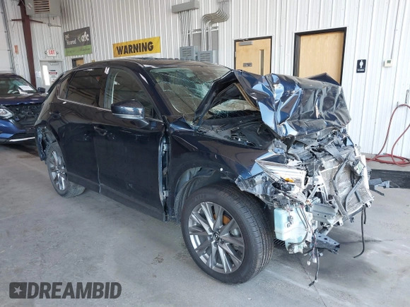 2020 Mazda CX-5 Grand Touring with VIN JM3KFBDM8L0781491, listed as a IAAI auction lot 39788385 with 57,316 mi miles and . Bid and sale history available at carsss.com. Image 1.