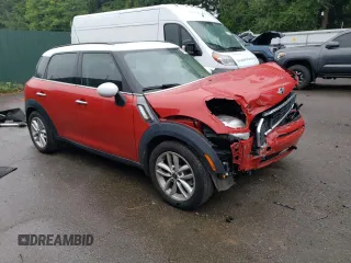 2014 MINI Countryman S with VIN WMWZC3C52EWP25379, listed as a Copart auction lot 61438355 with 76,943 mi miles and Salvage title. Bid and sale history available at DreamBid. Image 4.
