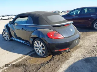 2014 Volkswagen Beetle 1.8T with VIN 3VW517AT4EM815243, listed as a IAAI auction lot 41245346 with 119,259 mi miles and . Bid and sale history available at DreamBid. Image 3.