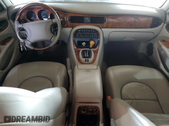 2000 Jaguar XJ with VIN SAJDA25B8YMF04079, listed as a Copart auction lot 50592595 with 131,647 mi miles and Salvage title. Bid and sale history available at DreamBid. Image 8.