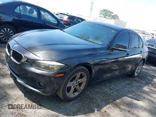 2014 BMW 3 Series 320i with VIN WBA3B1C56EK131849, listed as a IAAI auction lot 42018005 with 215,765 mi miles. Bid and sale history available at carsss.com. Image 2.