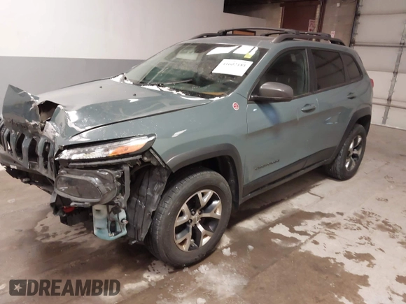 2015 Jeep Cherokee Trailhawk with VIN 1C4PJMBS6FW724931, listed as a IAAI auction lot 41602181 with 153,340 mi miles and . Bid and sale history available at carsss.com. Image 18.