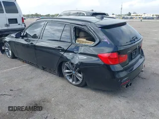 2014 BMW 3 Series 328i xDrive with VIN WBA3G7C57EKN37319, listed as a IAAI auction lot 41699235 with 93,671 mi miles and . Bid and sale history available at carsss.com. Image 3.