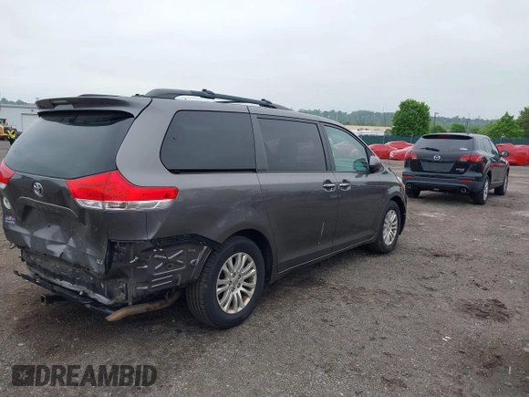 2014 Toyota Sienna XLE with VIN 5TDYK3DC0ES436502, listed as a IAAI auction lot 42180990 with 154,839 mi miles and . Bid and sale history available at DreamBid. Image 4.