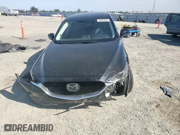 2018 Mazda CX-5 Grand Touring z VIN JM3KFBDM0J0399985, wystawiony jako Copart lot #54097665 z przebiegiem 45 344 mil mil oraz Szkoda całkowita • Salvage title. Historia ofert i sprzedaży dostępna na DreamBid. Obrazek 14.