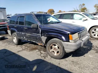 1998 Jeep Grand Cherokee Laredo with VIN 1J4GZ58S8WC167716, listed as a Copart auction lot 76477694 with 167,519 mi miles and Salvage Title. Bid and sale history available at carsss.com. Image 4.