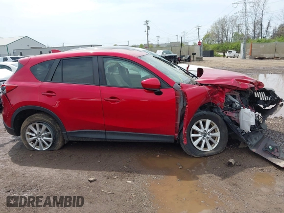 2014 Mazda CX-5 Touring with VIN JM3KE2CY4E0411780, listed as a IAAI auction lot 41903570 with 103,658 mi miles and . Bid and sale history available at DreamBid. Image 13.