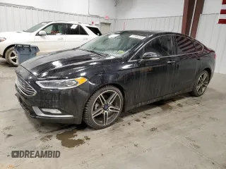 2017 Ford Fusion Titanium с VIN 3FA6P0D92HR183594, выставлен на аукционе Copart как лот 51982585 с пробегом 144 193 миль миль и Списание • Salvage title. История ставок и продаж доступна на DreamBid. Изображение 1.