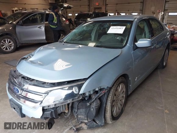 2010 Ford Fusion Hybrid z VIN 3FADP0L34AR276532, wystawiony jako IAAI lot #41491883 z przebiegiem 159 076 mil mil oraz . Historia ofert i sprzedaży dostępna na DreamBid. Obrazek 2.