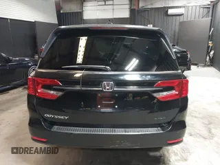2021 Honda Odyssey Touring with VIN 5FNRL6H83MB040138, listed as a IAAI auction lot 39150096 with 61,322 mi miles and . Bid and sale history available at DreamBid. Image 16.