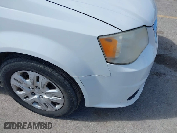 2014 Dodge Grand Caravan American Value with VIN 2C4RDGBG8ER140342, listed as a IAAI auction lot 42198306 with 135,564 mi miles and . Bid and sale history available at DreamBid. Image 13.