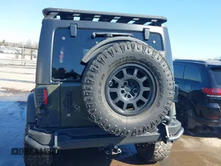 2015 Jeep Wrangler Unlimited Rubicon with VIN 1C4BJWFG0FL623431, listed as a IAAI auction lot 41651317 with 105,508 mi miles. Bid and sale history available at carsss.com. Image 16.