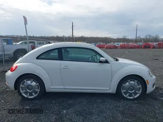 2014 Volkswagen Beetle 2.5L w/Sun with VIN 3VWJP7AT8EM611560, listed as a IAAI auction lot 41488488 with 140,798 mi miles and . Bid and sale history available at DreamBid. Image 14.
