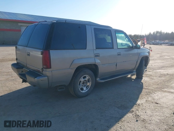 2000 GMC Denali with VIN 1GKEK13R7YR159609, listed as a IAAI auction lot 41828674 with 231,627 mi miles. Bid and sale history available at carsss.com. Image 4.
