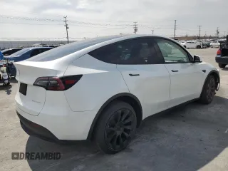 2023 Tesla Model Y Long Range z VIN 7SAYGDEE8PA030286, wystawiony jako Copart lot #50945465 z przebiegiem 43 676 mil mil oraz Szkoda całkowita • Salvage title. Historia ofert i sprzedaży dostępna na DreamBid. Obrazek 3.