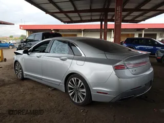 2017 Lincoln MKZ Reserve z VIN 3LN6L5E93HR603246, wystawiony jako IAAI lot #42024614 z przebiegiem 131 622 mil mil oraz . Historia ofert i sprzedaży dostępna na DreamBid. Obrazek 3.
