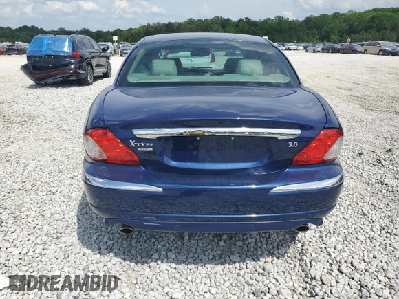 2004 Jaguar X-Type with VIN SAJEA51C44WD83361, listed as a Copart auction lot 55643545 with 54,615 mi miles and Salvage Title. Bid and sale history available at DreamBid. Image 6.