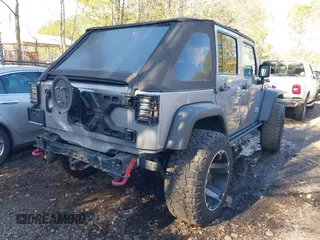 2015 Jeep Wrangler Unlimited Rubicon Hard Rock with VIN 1C4HJWFG1FL777222, listed as a IAAI auction lot 41843893 with 74,718 mi miles and . Bid and sale history available at DreamBid. Image 4.