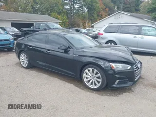 2018 Audi A5 Sportback Premium Plus with VIN WAUBNCF55JA005590, listed as a IAAI auction lot 40310229 with 79,101 mi miles. Bid and sale history available at carsss.com. Image 1.