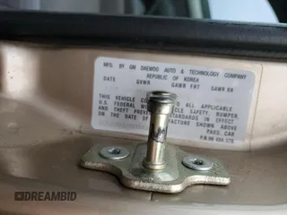 2007 Suzuki Forenza z VIN KL5JD56Z07K657218, wystawiony jako Copart lot #86767854 z przebiegiem 93 044 mil mil oraz Szkoda całkowita • Salvage title. Historia ofert i sprzedaży dostępna na DreamBid. Obrazek 12.
