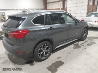 2016 BMW X1 xDrive28i with VIN WBXHT3C3XG5E47536, listed as a IAAI auction lot 41672144 with 97,932 mi miles. Bid and sale history available at carsss.com. Image 4.