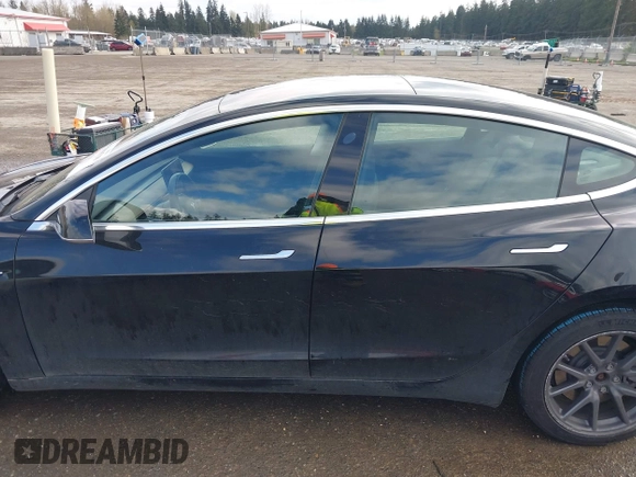 2019 Tesla Model 3 Mid Range with VIN 5YJ3E1EA4KF305611, listed as a IAAI auction lot 41916738 with 59,101 mi miles and . Bid and sale history available at carsss.com. Image 14.