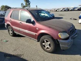 1999 Mercedes-Benz M-Class with VIN 4JGAB54E4XA101754, listed as a Copart auction lot 77903984 with 187,810 mi miles and Salvage Title. Bid and sale history available at carsss.com. Image 4.