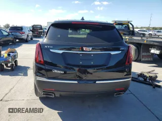 2022 Cadillac XT5 FWD Luxury with VIN 1GYKNAR45NZ118872, listed as a Copart auction lot 79676544 with 31,467 mi miles and Salvage title. Bid and sale history available at DreamBid. Image 6.