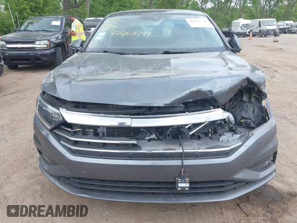 2021 Volkswagen Jetta SEL Premium z VIN 3VWG57BU8MM017203, wystawiony jako IAAI lot #42263741 z przebiegiem 26 556 mil mil oraz . Historia ofert i sprzedaży dostępna na DreamBid. Obrazek 12.