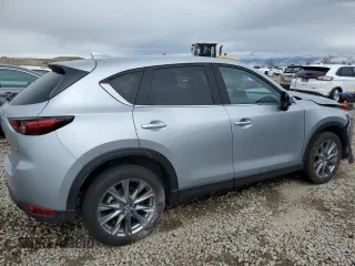 2021 Mazda CX-5 Grand Touring with VIN JM3KFBDM1M1403699, listed as a Copart auction lot 49888655 with 29,919 mi miles and Salvage Title. Bid and sale history available at carsss.com. Image 3.