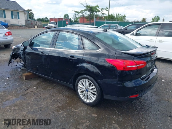2016 Ford Focus Titanium z VIN 1FADP3J27GL215436, wystawiony jako IAAI lot #42709166 z przebiegiem 75 956 mil mil oraz . Historia ofert i sprzedaży dostępna na DreamBid. Obrazek 3.
