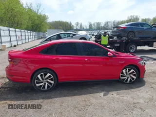 2019 Volkswagen Jetta GLI S z VIN 3VW6T7BU3KM255295, wystawiony jako IAAI lot #42173746 z przebiegiem 63 526 mil mil oraz . Historia ofert i sprzedaży dostępna na DreamBid. Obrazek 13.