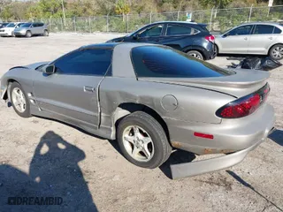 2000 Pontiac Firebird with VIN 2G2FS22K0Y2112410, listed as a IAAI auction lot 41676541 with 129,857 mi miles. Bid and sale history available at carsss.com. Image 3.