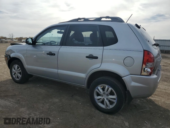 2009 Hyundai Tucson GLS with VIN KM8JM12B79U012399, listed as a Copart auction lot 77663414 with 164,615 mi miles and Salvage Title. Bid and sale history available at carsss.com. Image 2.