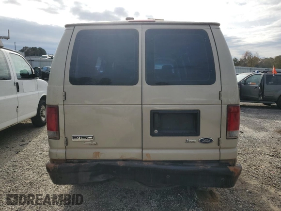2010 Ford Econoline Passenger XL with VIN 1FMNE1BWXADA30935, listed as a Copart auction lot 77912734 with 153,775 mi miles and Salvage Title. Bid and sale history available at DreamBid. Image 6.