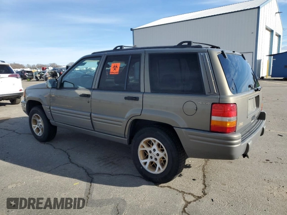 1997 Jeep Grand Cherokee Limited with VIN 1J4GZ78Y4VC754624, listed as a Copart auction lot 49884435 with 144,682 mi miles and Salvage Title. Bid and sale history available at carsss.com. Image 2.