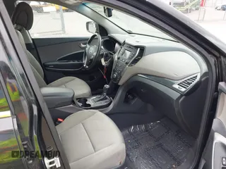 2014 Hyundai Santa Fe z VIN 5XYZUDLB8EG196450, wystawiony jako IAAI lot #42112914 z przebiegiem 91 710 mil mil oraz . Historia ofert i sprzedaży dostępna na DreamBid. Obrazek 5.
