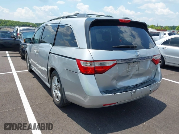 2011 Honda Odyssey Touring with VIN 5FNRL5H99BB058448, listed as a IAAI auction lot 42651432 with 208,581 mi miles and . Bid and sale history available at DreamBid. Image 3.