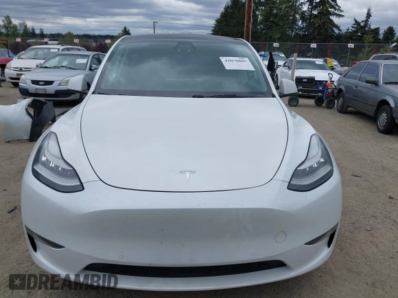 2021 Tesla Model Y Long Range with VIN 5YJYGDEE6MF082883, listed as a IAAI auction lot 42078807 with 64,953 mi miles. Bid and sale history available at carsss.com. Image 13.
