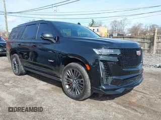 2023 Cadillac Escalade AWD V-Series z VIN 1GYS4HK90PR201792, wystawiony jako IAAI lot #41952175 z przebiegiem 9 310 mil mil oraz . Historia ofert i sprzedaży dostępna na DreamBid. Obrazek 1.