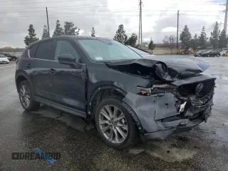 2020 Mazda CX-5 Grand Touring with VIN JM3KFADM3L0815055, listed as a Copart auction lot 48175245 with 56,602 mi miles and Salvage Title. Bid and sale history available at carsss.com. Image 4.