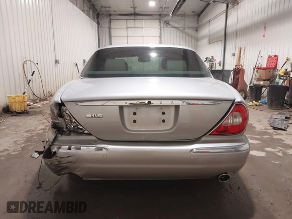 2004 Jaguar XJ with VIN SAJWA71C04SG33993, listed as a IAAI auction lot 41193040 with 79,944 mi miles. Bid and sale history available at carsss.com. Image 16.