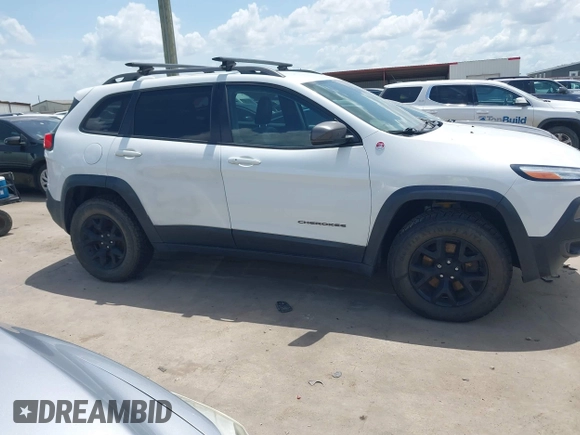 2014 Jeep Cherokee Trailhawk with VIN 1C4PJMBS5EW231448, listed as a IAAI auction lot 42632143 with 97,461 mi miles and . Bid and sale history available at DreamBid. Image 13.