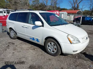 2009 Kia Sedona LX with VIN KNDMB233096312990, listed as a IAAI auction lot 41261428 with 254,323 mi miles. Bid and sale history available at carsss.com. Image 1.